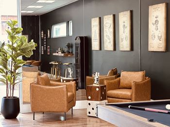 Lounge with leather chairs and pool table